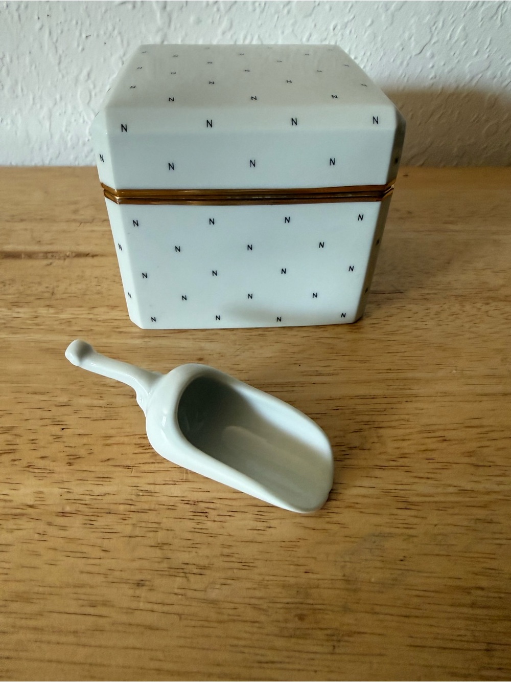 Vintage Norell porcelain powder box with scoop.